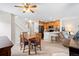 Inviting open-concept living space with a dining area, featuring a modern kitchen and a comfortable seating area at 3748 Oakwood Dr, Longmont, CO 80503