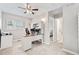 Office with carpet, overhead fan, built-in desk with cabinets, and natural light at 3748 Oakwood Dr, Longmont, CO 80503