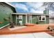 Inviting front porch area, with a cozy seating arrangement, and a well-designed wooden deck at 13298 Alcott Cir, Broomfield, CO 80020