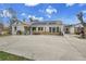 Expansive backyard patio with stone accents, a grill, and charming seating creating a welcoming outdoor space at 7060 Holly St, Commerce City, CO 80022