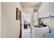 Laundry room with appliances, cabinets and access to other parts of the home at 7060 Holly St, Commerce City, CO 80022
