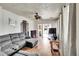 Living room with hardwood floors, fireplace, ceiling fan and natural light at 7060 Holly St, Commerce City, CO 80022