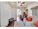 Living room with hardwood floors, ceiling fan, natural light, and a comfortable sofa at 7060 Holly St, Commerce City, CO 80022