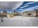 Large backyard with a storage shed, surrounded by a wooden fence at 2332 W Baltic Pl, Englewood, CO 80110