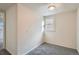 Small bedroom space with light walls and carpeted floor at 2332 W Baltic Pl, Englewood, CO 80110