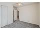 Bedroom featuring closet and neutral color carpet at 2332 W Baltic Pl, Englewood, CO 80110