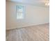 Inviting bedroom with hardwood floors and large window at 2332 W Baltic Pl, Englewood, CO 80110