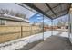 Covered patio area offers outdoor space for relaxing or entertaining at 2332 W Baltic Pl, Englewood, CO 80110