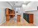 Finished basement space features tile flooring and is set up as an office with built-in desk and shelving at 4819 Jericho Ct, Denver, CO 80249