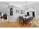 Spacious dining area with hardwood floors, stylish lighting, and seamless flow to the living spaces at 4819 Jericho Ct, Denver, CO 80249