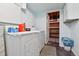 Functional laundry room with modern appliances and convenient storage solutions at 4819 Jericho Ct, Denver, CO 80249
