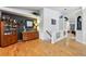 Spacious living area with stylish decor, hardwood floors, and seamless transition to other living spaces at 4819 Jericho Ct, Denver, CO 80249