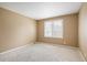 Bedroom features neutral carpet, neutral paint, and plantation shutters at 4605 S Yosemite St # 36, Denver, CO 80237