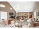 Bright common room featuring hardwood-style floors, high ceilings, and a coffee bar with tables and comfortable chairs at 4605 S Yosemite St # 36, Denver, CO 80237