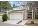 Charming home featuring stone accents, a two-car garage, manicured lawn, and inviting curb appeal at 4605 S Yosemite St # 36, Denver, CO 80237