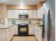Efficient kitchen featuring stainless steel appliances, granite countertops, and light wood cabinetry at 4605 S Yosemite St # 36, Denver, CO 80237