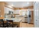 Well-lit kitchen with granite countertops, stainless steel appliances, and ample cabinetry at 4605 S Yosemite St # 36, Denver, CO 80237