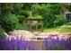 Picturesque landscaping featuring a walking bridge over a creek and lush greenery at 4605 S Yosemite St # 36, Denver, CO 80237
