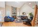 Bright living room boasts vaulted ceilings, a stone fireplace, and hardwood floors at 4605 S Yosemite St # 36, Denver, CO 80237