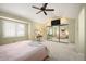 Main bedroom features vaulted ceiling, plush carpet, ceiling fan, and mirrored closet doors at 4605 S Yosemite St # 36, Denver, CO 80237