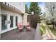 Wooden patio with outdoor seating overlooks backyard stream at 4605 S Yosemite St # 36, Denver, CO 80237