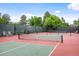 Well-maintained community tennis courts surrounded by lush greenery at 4605 S Yosemite St # 36, Denver, CO 80237