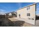 View of the back of the home, backyard, and patio at 47356 Lilac Ave, Bennett, CO 80102