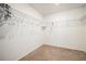 Walk-in closet with wall-mounted wire shelving, neutral paint, and plush carpet at 47356 Lilac Ave, Bennett, CO 80102