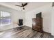 The bedroom features a desk, a comfortable chair, a dresser with a TV, and a ceiling fan for relaxing at 4555 S Auckland Ct, Aurora, CO 80015