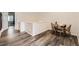 This dining area features wood floors, adjacent to room with lots of natural light at 4555 S Auckland Ct, Aurora, CO 80015
