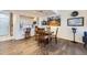 Dining area adjacent to the kitchen, featuring wood floors and recessed lighting at 4555 S Auckland Ct, Aurora, CO 80015