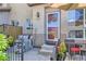 Charming front entrance with seating, flowers, and well-maintained exterior at 4555 S Auckland Ct, Aurora, CO 80015