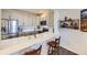 Modern kitchen with stainless steel appliances and quartz countertops at 4555 S Auckland Ct, Aurora, CO 80015
