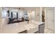 Open-concept kitchen with a large island, stainless steel appliances, and dining area perfect for entertaining guests at 4555 S Auckland Ct, Aurora, CO 80015