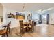 Dining room with a view of the living area, featuring hardwood floors at 4555 S Auckland Ct, Aurora, CO 80015