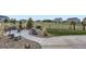 Landscaped backyard area with a sitting area, plants, rocks, and decorative gravel at 5641 Echo Hollow St, Castle Rock, CO 80104
