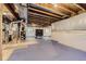 Unfinished basement with exposed ceiling, concrete flooring, and utility connections at 5641 Echo Hollow St, Castle Rock, CO 80104