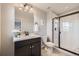 Modern bathroom with black vanity, white subway tile shower, and stylish fixtures at 5641 Echo Hollow St, Castle Rock, CO 80104