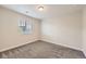 This bedroom has carpeted floors and a window providing natural light at 5641 Echo Hollow St, Castle Rock, CO 80104