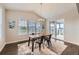 Dining area with modern light fixture, views and access to backyard at 5641 Echo Hollow St, Castle Rock, CO 80104