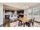 Dining area next to an open kitchen and lots of natural light at 5641 Echo Hollow St, Castle Rock, CO 80104