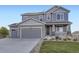 Charming two-story home with landscaped front yard and an attached two car garage at 5641 Echo Hollow St, Castle Rock, CO 80104