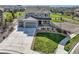 Charming two-story home with a three-car garage, lush lawn, and a welcoming front porch, perfect for Gathering living at 5641 Echo Hollow St, Castle Rock, CO 80104