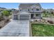 Charming two-story home with a three car garage and landscaped front yard at 5641 Echo Hollow St, Castle Rock, CO 80104