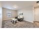 This living room has carpeted floors with neutral walls, a window, and modern furnishings at 5641 Echo Hollow St, Castle Rock, CO 80104