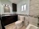 Modern bathroom featuring blue accents, wood-grain tile, and a sink with a contemporary vanity at 26259 Kingsbury Rd, Kittredge, CO 80457