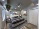 Bright bedroom featuring a comfortable bed, neutral walls, recessed lighting, and an attached closet at 26259 Kingsbury Rd, Kittredge, CO 80457