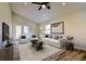 Comfortable living room with modern furniture, neutral decor, and ample natural light from the French doors at 26259 Kingsbury Rd, Kittredge, CO 80457