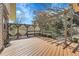 Relaxing backyard deck space with pergola, bench seating, and well-maintained wood flooring at 6116 W Frost Dr, Littleton, CO 80128