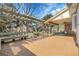 Large backyard deck with seating area, pergola, and a beautiful garden view at 6116 W Frost Dr, Littleton, CO 80128